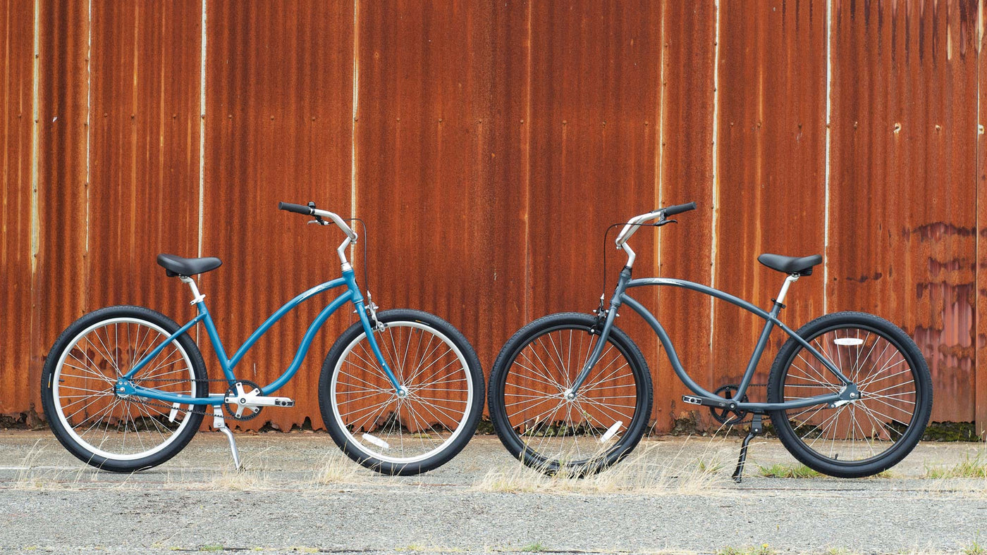 low rust cypre bikes beach cruisers in front of a rusty wall 