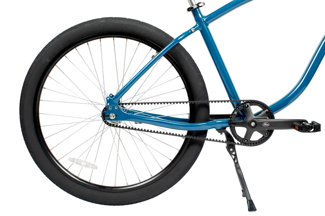 Blue bicycle with a focus on the chain and gear system on a white background