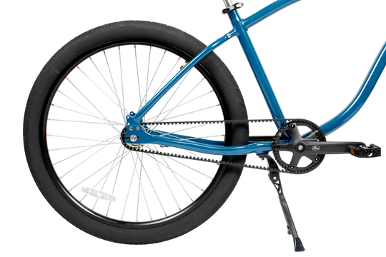 Blue bicycle with a focus on the chain and gear system on a white background